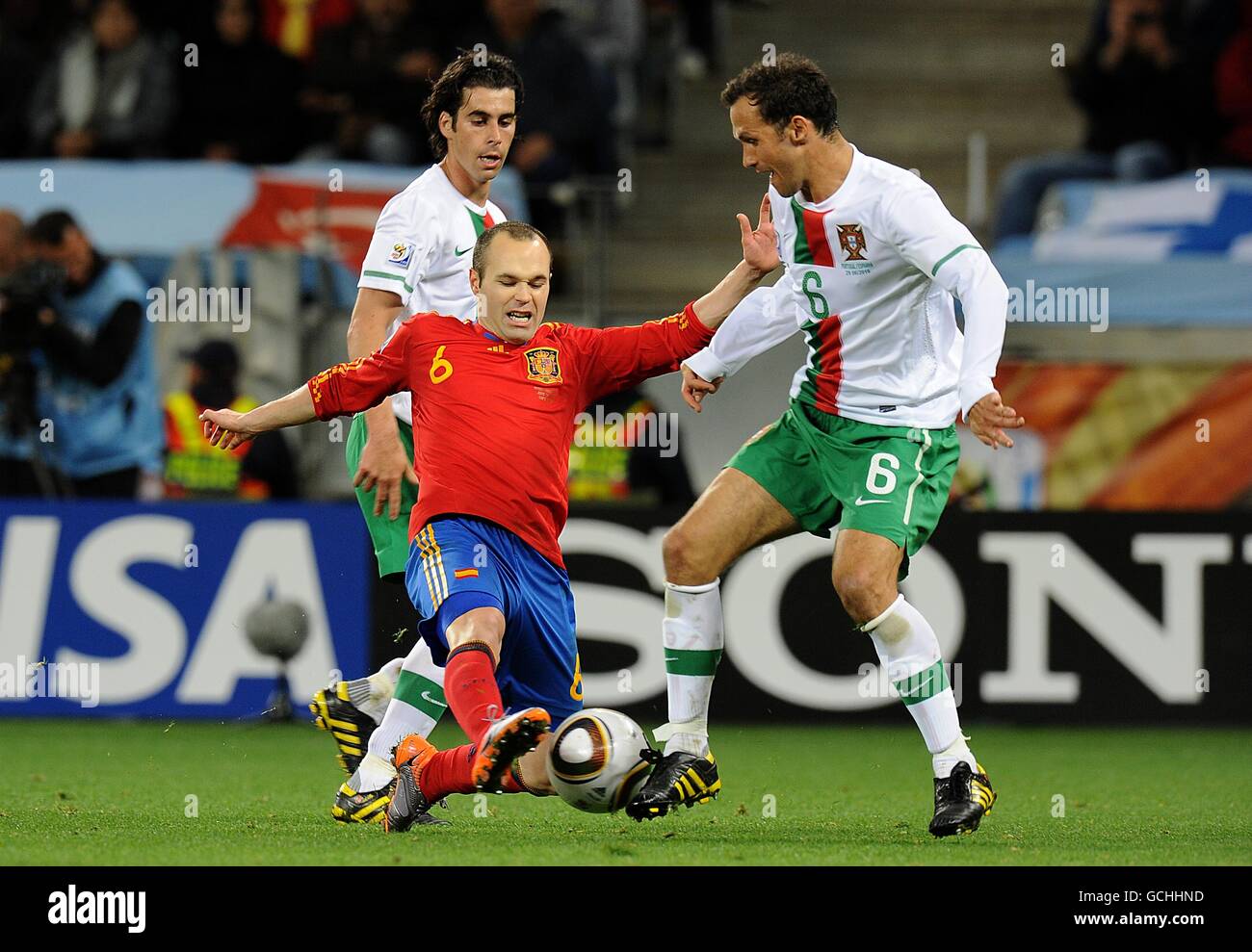 Soccer - 2010 FIFA World Cup South Africa - Round Of 16 - Spain v Portugal - Green Point Stadium. Spain's Andres Iniesta (left) and Portugal's Ricardo Carvalho battle for the ball Stock Photo