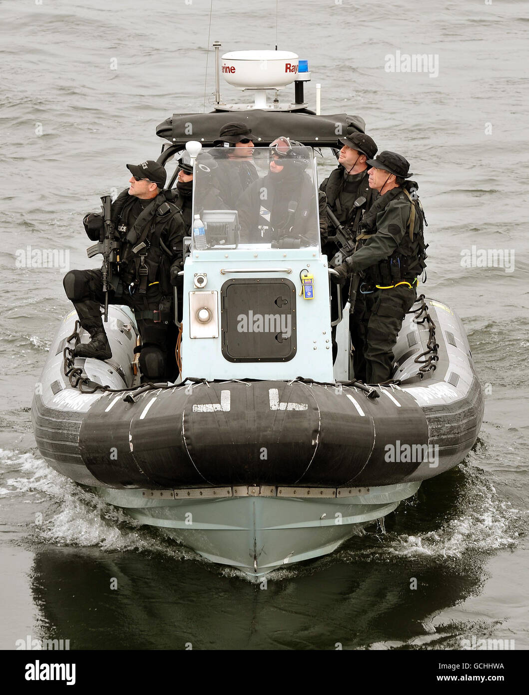 Canadian Police patrol during the Queen's appearance at a Naval review to mark the 100th anniversary of the Canadian Navy, in the waters off Halifax in Nova Scotia, Canada. Stock Photo