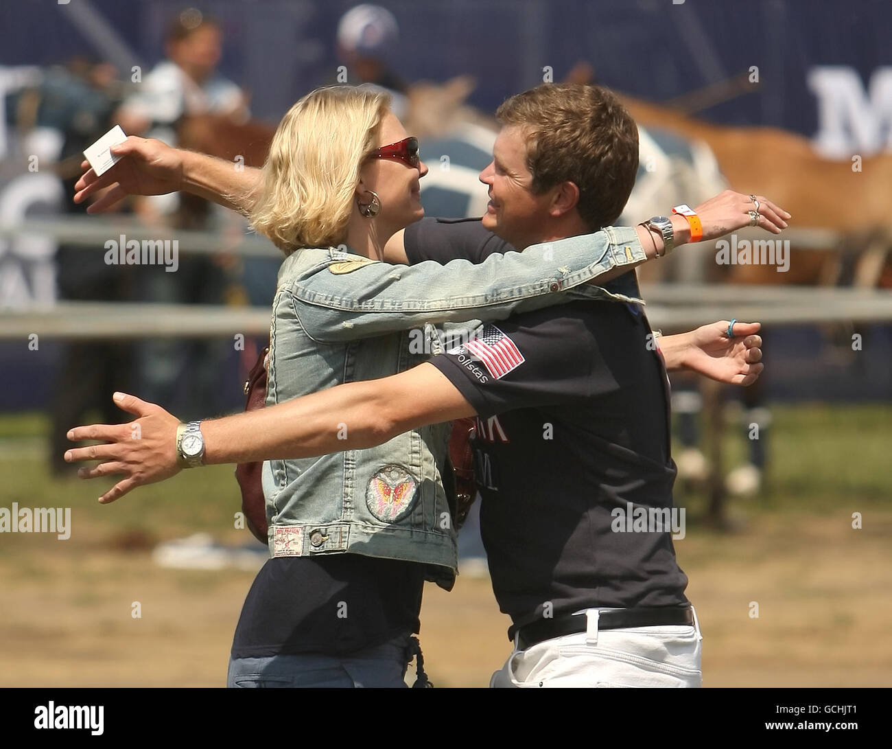Jodie Kidd greets her brother Jack, who is playing at the MINT Polo in the Park, at Hurlingham Park, in Fulham, south west London. Stock Photo