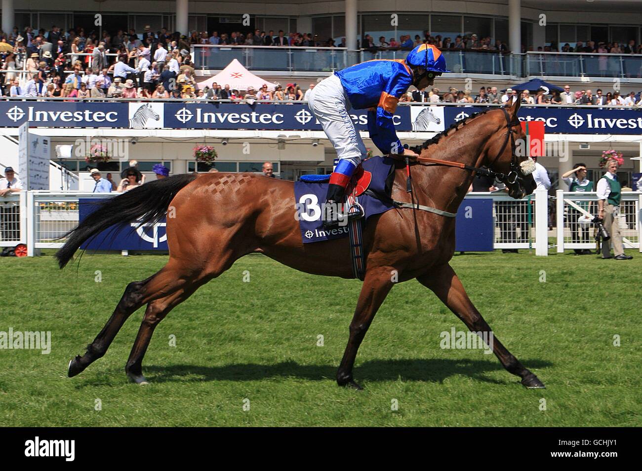 Extraterrestrial ridden by Frankie Dettori going to post for the Investec Mile during Ladies Day, at Epsom Racecourse Stock Photo