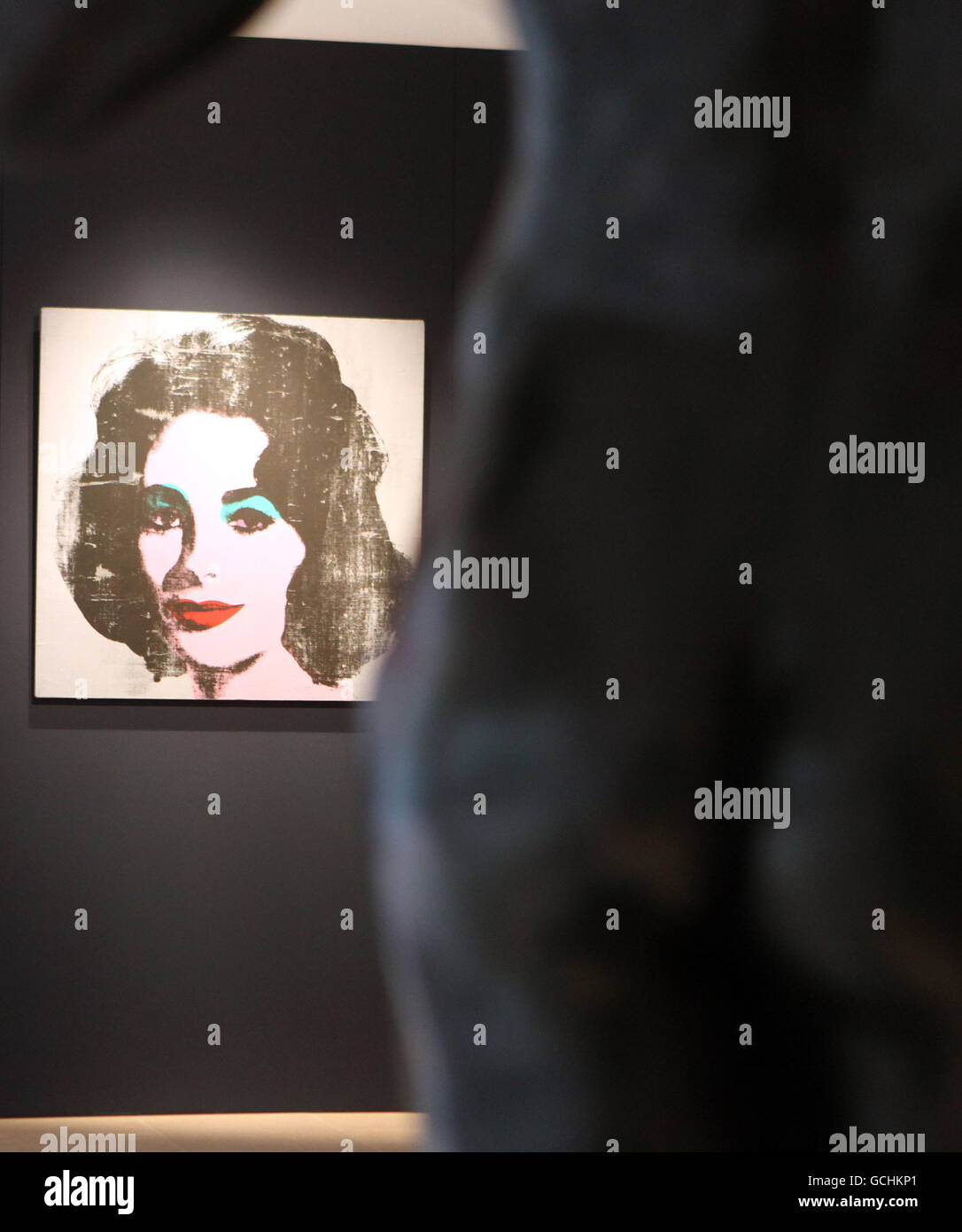 A rare Andy Warhol portrait of Elizabeth Taylor, 'Silver Liz, 1963', pictured with a bronze sculpture by Auguste Rodin. Stock Photo