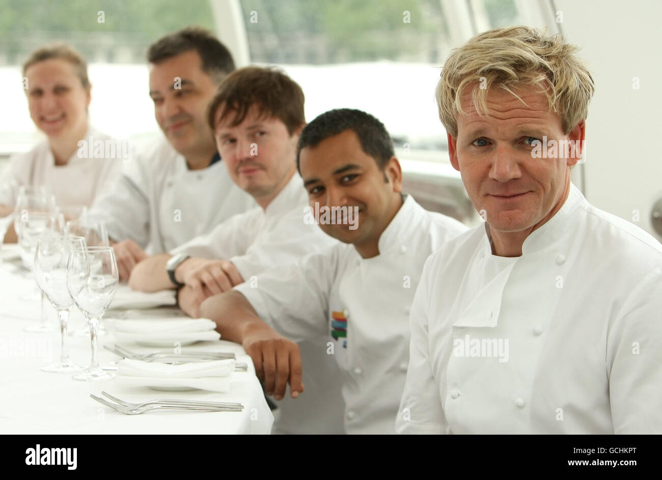 (Left to right) chefs Angela Hartnett, Joel Antunes, Kevin Gratton, Jitin Joshi and Gordon Ramsay sit around a dining table in a capsule of the London Eye, which is to be turned into a revolving restaurant for the London Restaurant Festival, which runs from 4 - 18 October 2010. Stock Photo
