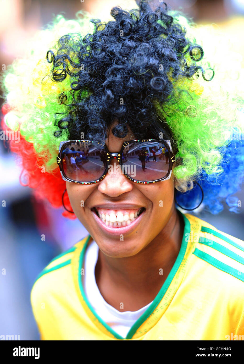 A woman wears a South African coloured wig in Nelson Mandela square in