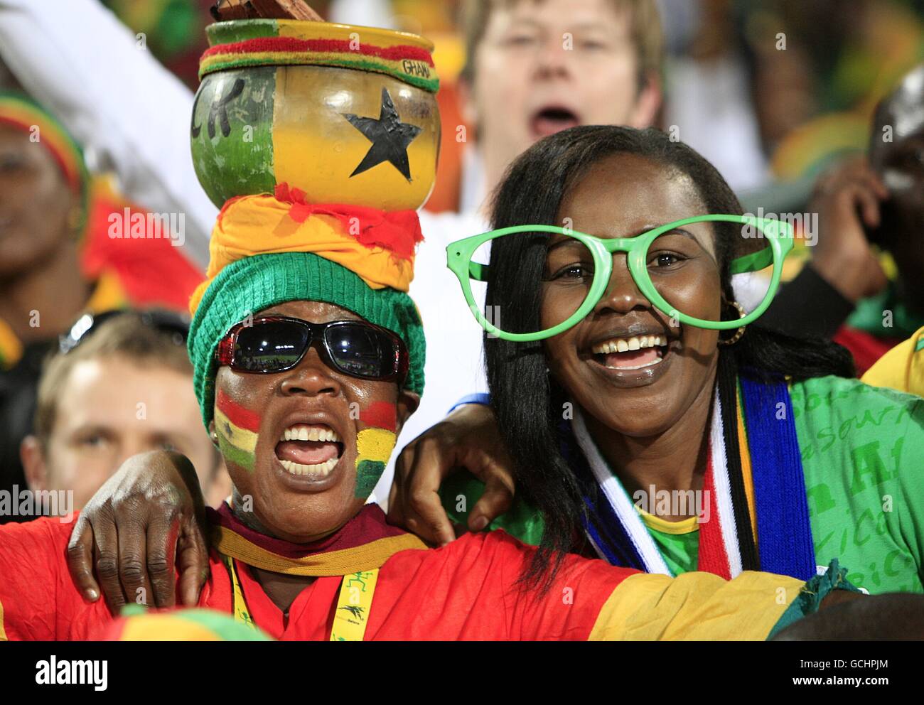 Ghana fans celebrate in the stands hires stock photography and images
