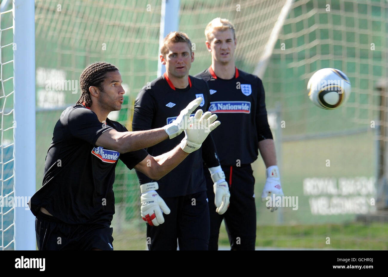 England goalkeeper David James (left) is watched by Robert Green (centre) and Joe Hart (right) during the training session at the Royal Bafokeng Sports Complex, Rustenburg, South Africa. Stock Photo