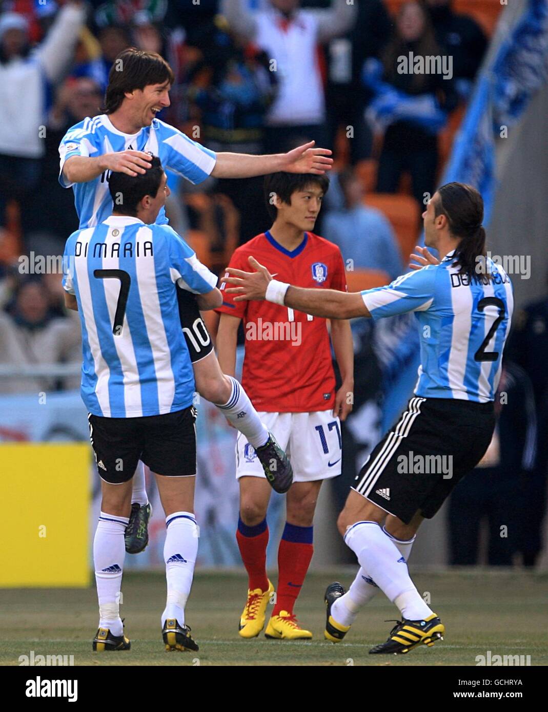 Argentina's Leo Messi, Angel Di Maria and Martin Demichelis (top left to right) celebrate after South Korea's Chu-Young Park scores an own goal to make it 1-0 Stock Photo
