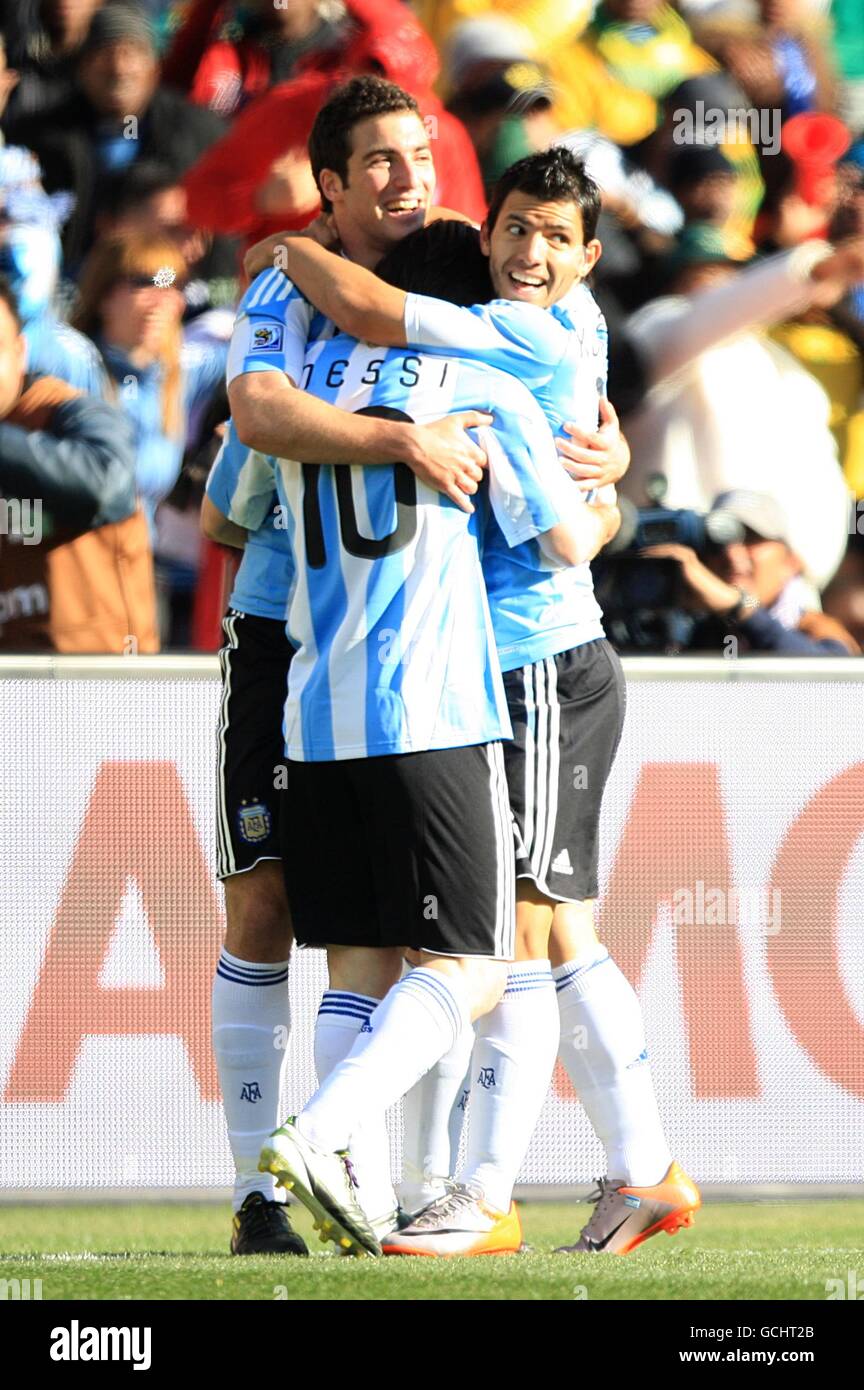 Soccer - 2010 FIFA World Cup South Africa - Group B - Argentina v South Korea - Soccer City Stadium. Argentina's Gonzalo Higuain (left) celebrates scoring his sides third goal with teammates Sergio Aguero (right) and Leo Messi (centre) Stock Photo