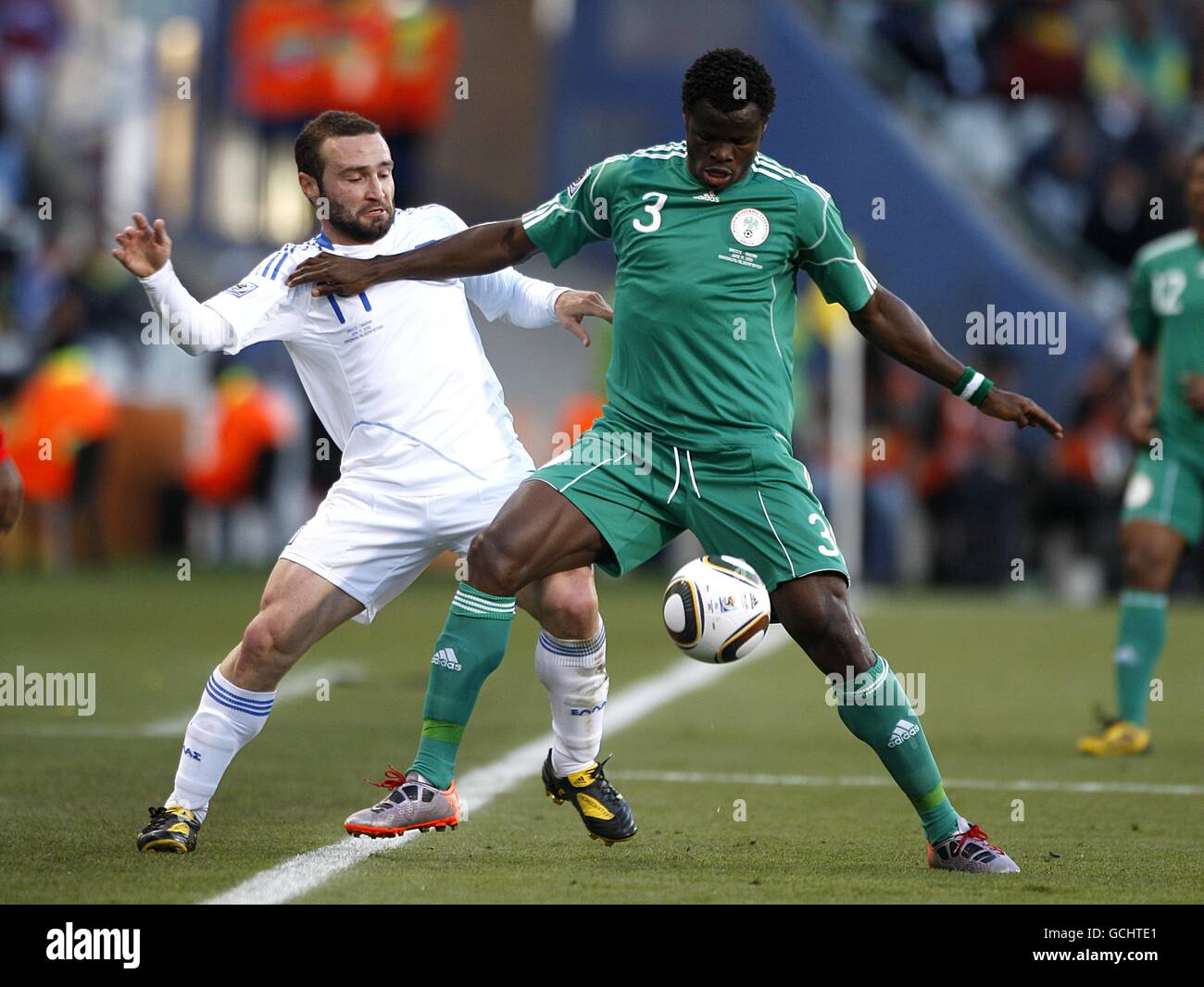 Nigeria's Taye Taiwo (right) and Greece's Dimitris Salpingidis battle for the ball Stock Photo