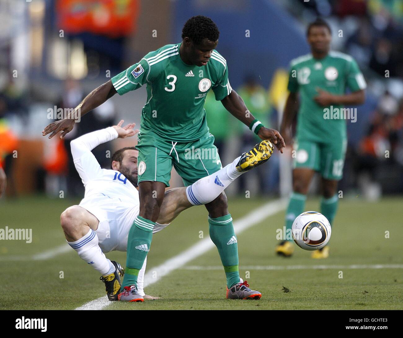 Nigeria's Taye Taiwo (left) and Greece's Dimitris Salpingidis battle for the ball Stock Photo