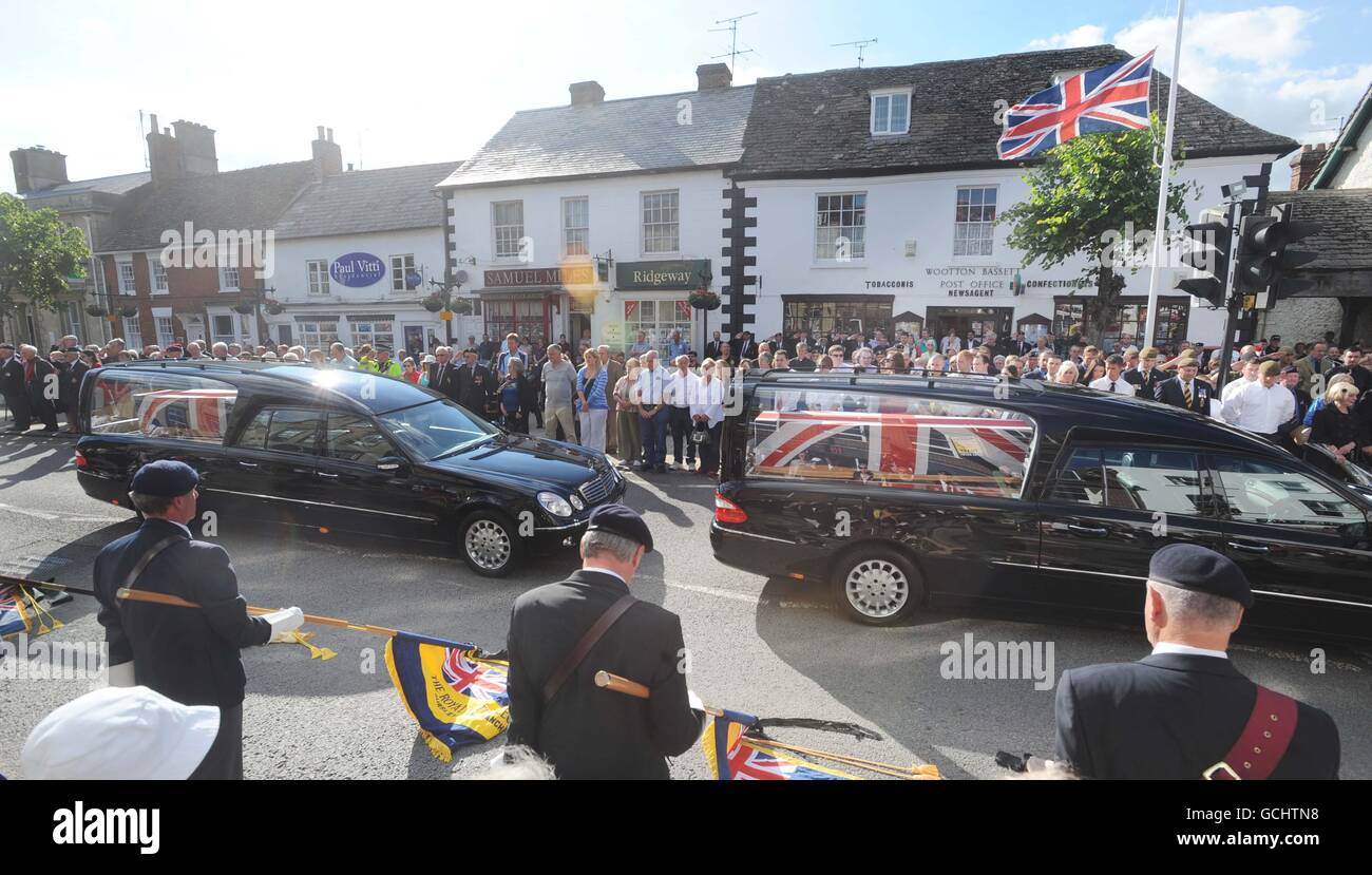 Mourners watch as the coffin of Lance Corporal Andrew Breeze (right ...