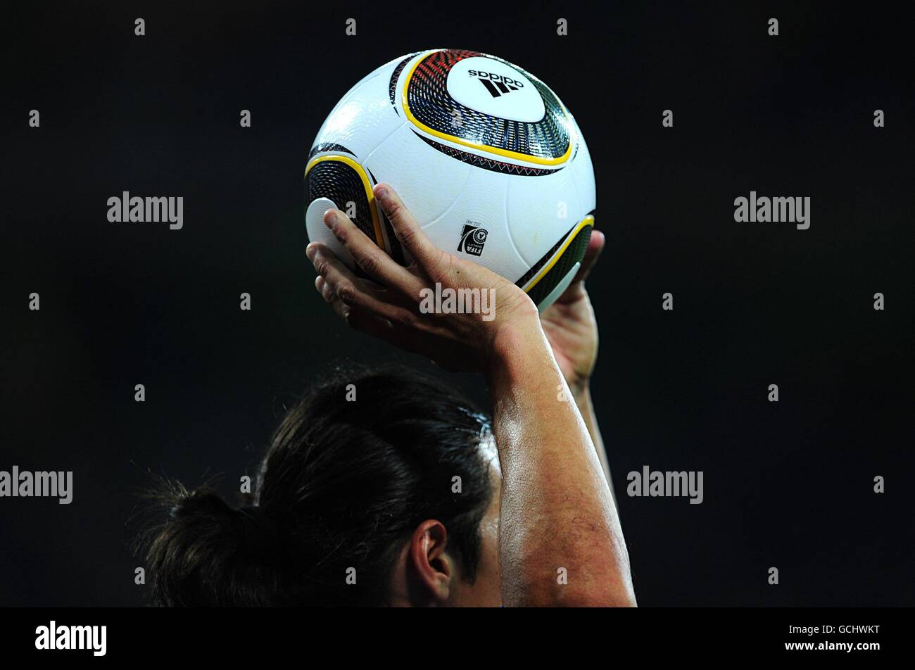 General view of the Jabulani world cup ball in the hands of Italy's Mauro Camoranesi as he prepares to take a throw in Stock Photo