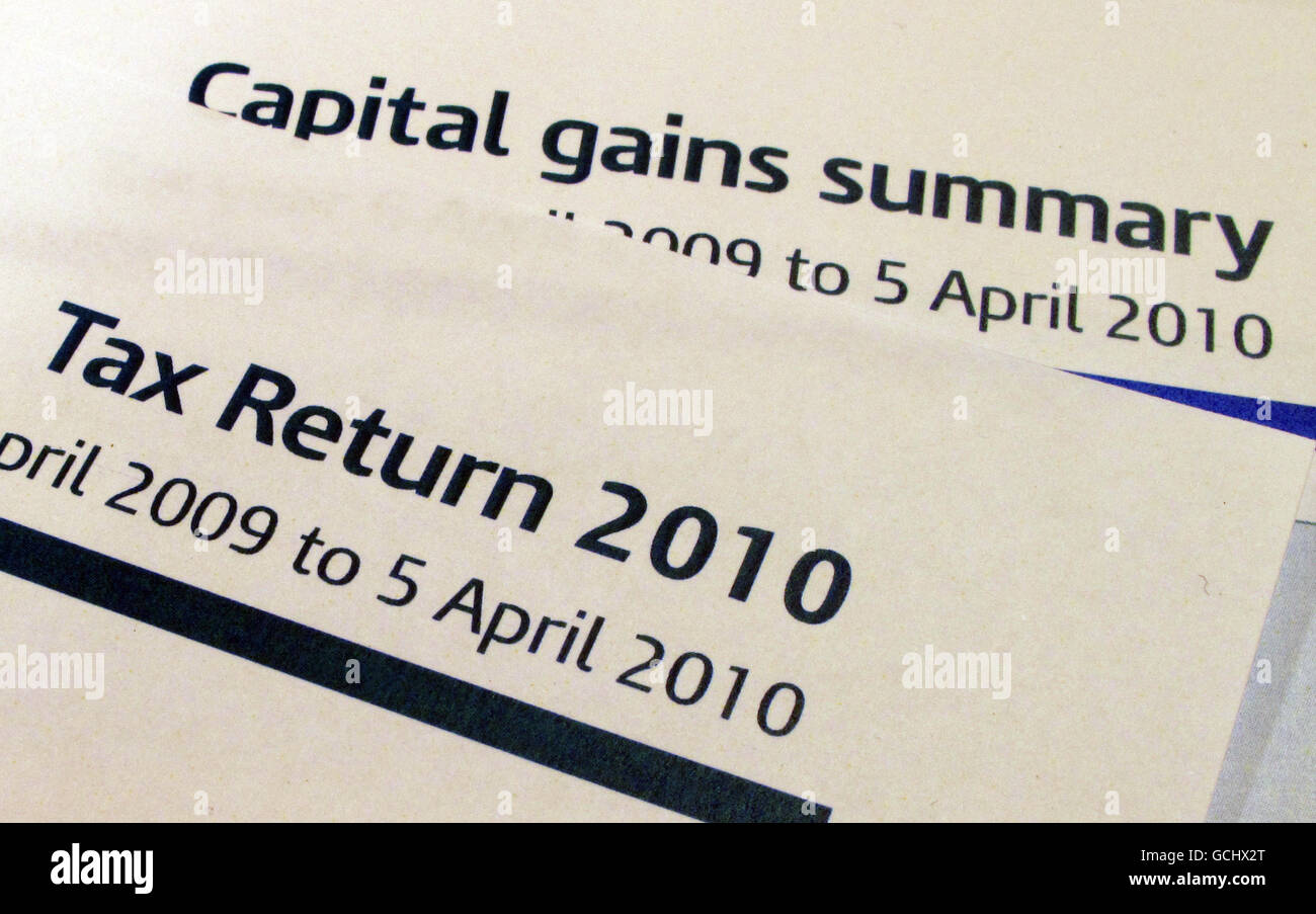 A Tax Return (Self Assessment form) and a Capital Gains summary form from HM Revenue and Customs ( HMRC ). Stock Photo