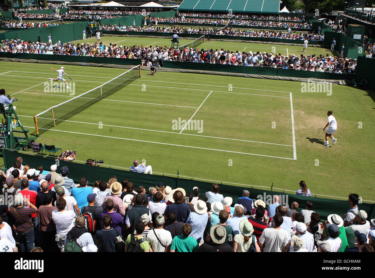 Tennis - 2010 Wimbledon Championships - Day Two - The All England Lawn Tennis and Croquet Club. A view across courts 8, 9, 10 and 11 Stock Photo