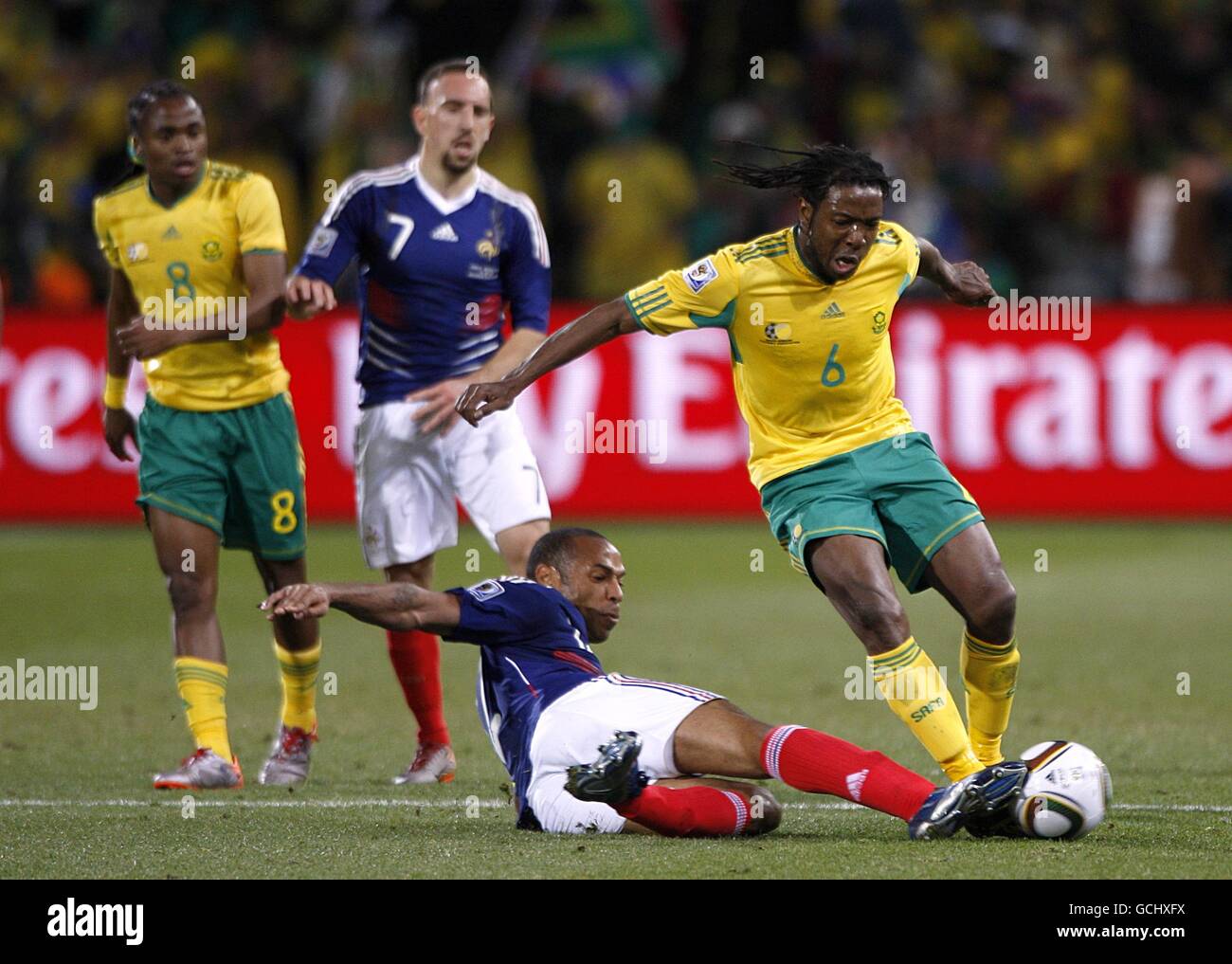 South Africa's Macbeth Sibaya (right) and France's Thierry Henry (centre) battle for the ball Stock Photo