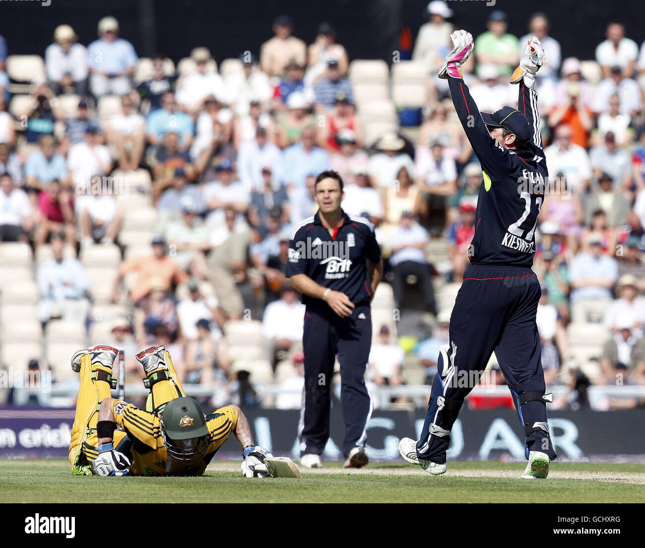 Australia's Michael Hussey (floor) survives a run out attempt during the First Natwest One Day International match at the Rose Bowl, Southampton. Stock Photo