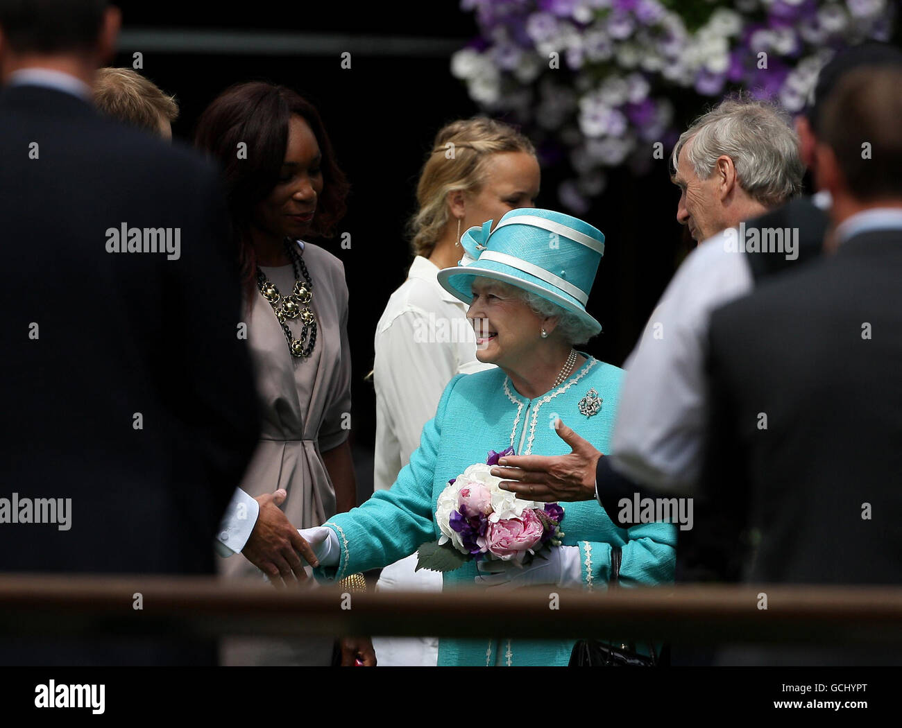 Britain's Queen Elizabeth II greets Serena Williams and other tennis