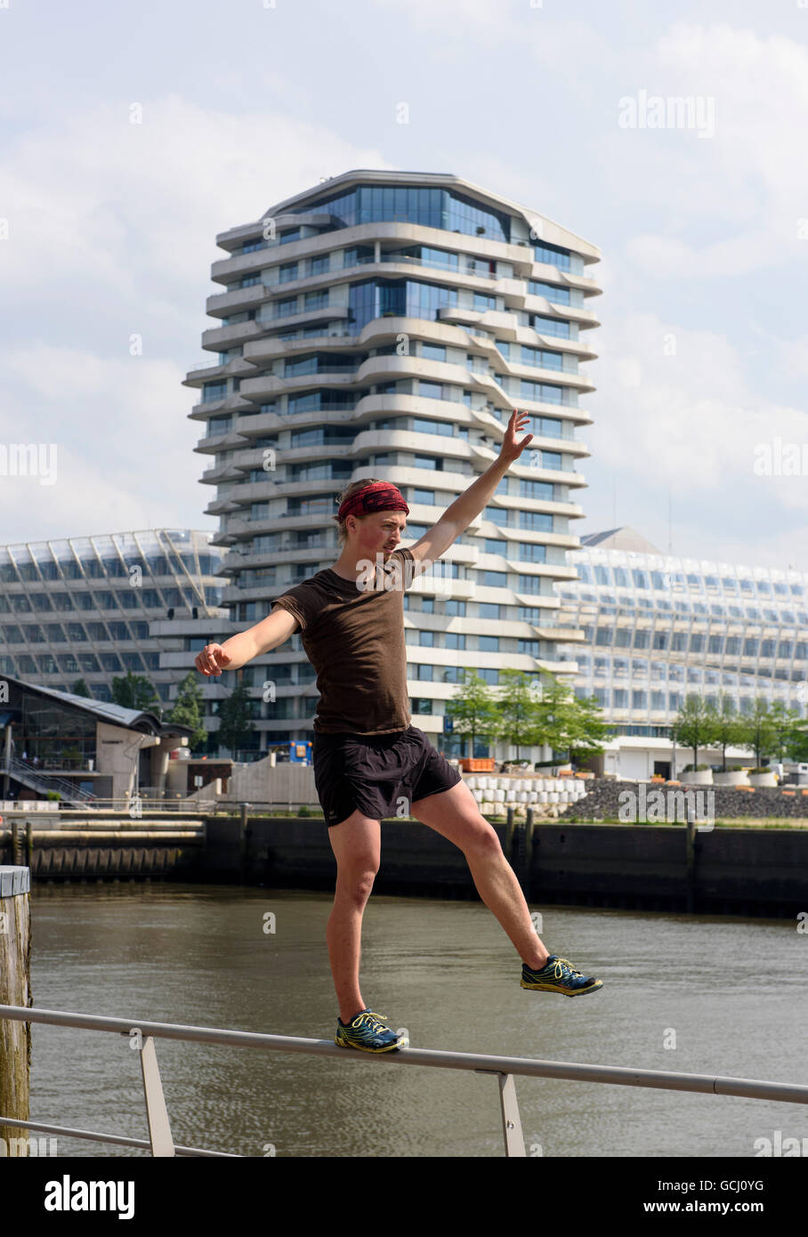 Streetsport 'Parkour' in front of  Marco-Polo-Tower in  Hafencity, Hamburg, Germany Stock Photo