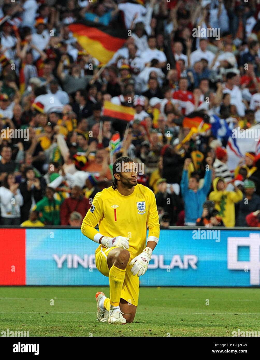Soccer - 2010 FIFA World Cup South Africa - Round Of 16 - Germany v England - Free State Stadium. England goalkeeper David James kneels dejected after conceding a fourth goal Stock Photo