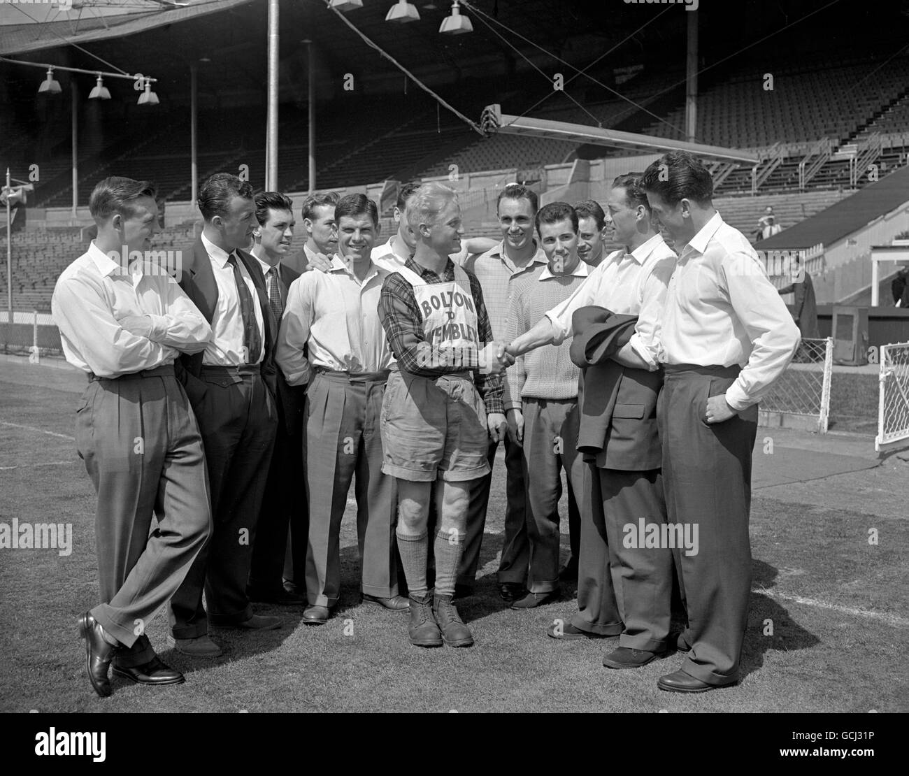 Members of the bolton wanderers team greet mr roy pilkington hires