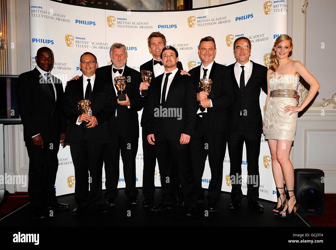 (left to right) Joseph Paterson, Derek Wax, Laurie Borg, Nick Murphy, Warren Brown, Peter Bowker, James Nesbitt and Romola Garai with the Drama Serial award received for Occupation at the BAFTA television awards at the London Palladium. Stock Photo