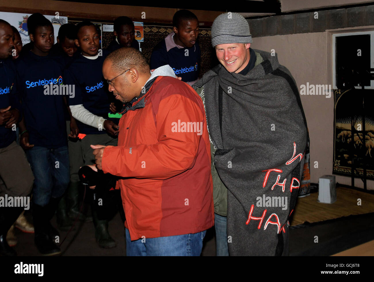 Prince Harry and Prince Seeiso dance on stage at St Leonard's Herd Boy School in Semonkong, Lesotho. Stock Photo