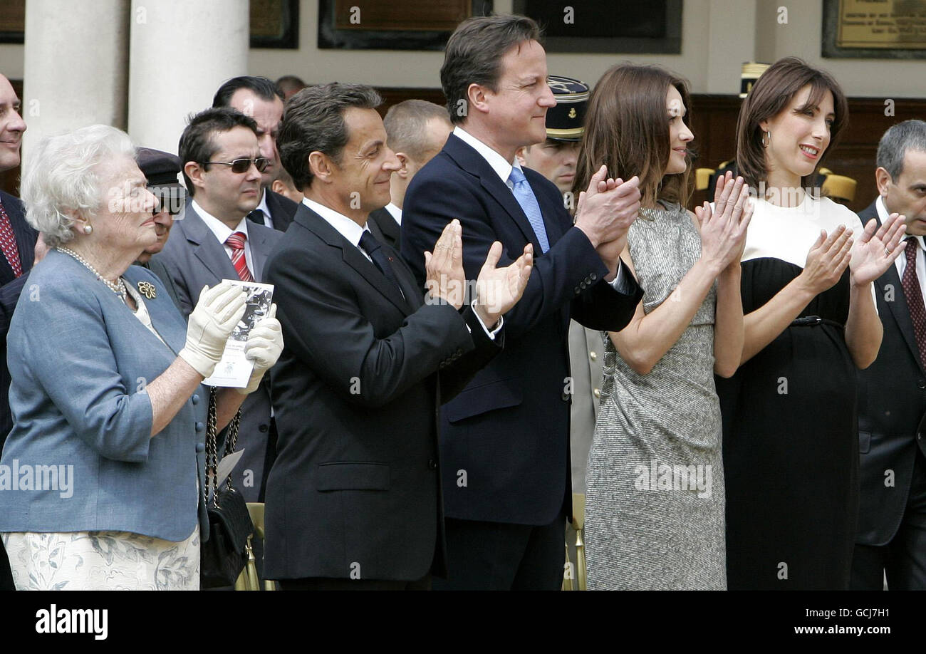 Lady Soames, daughter of Britain's former Prime Minister Winston Churchill, France's President Nicolas Sarkozy, Britan's Prime Minister David Cameron, Sarkozy's wife Carla Bruni-Sarkozy, and Cameron's wife Samantha Cameron, from left, attend a ceremony during his visit to the Royal Hospital Chelsea in London. Stock Photo