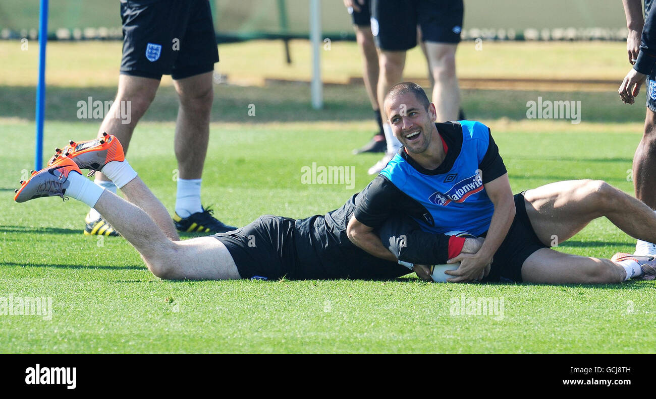 Soccer - 2010 FIFA World Cup South Africa - Group C - England v Slovenia - England Training Session - Day Three - Royal Bafok.... England's Joe Cole holds down Wayne Rooney during a training session at the Royal Bafokeng Sports Complex, Rustenburg, South Africa. Stock Photo