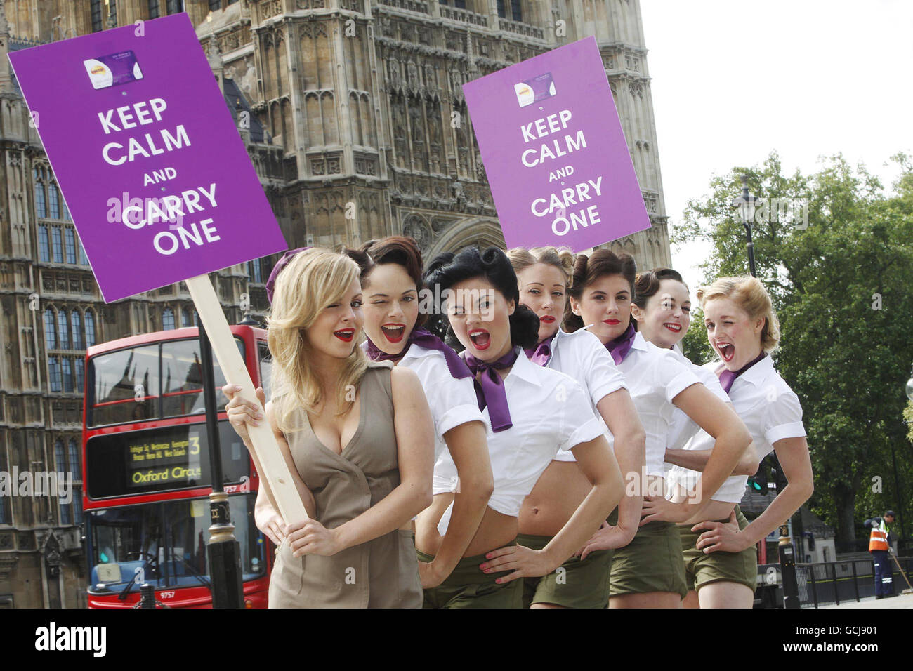 TV actress Tina O'Brien (left) and the 'Nectar Budget Babes' rally the nation to 'Keep Calm and Carry One' in Parliament Square, London. As the government unveils its Budget, Nectar is encouraging consumers to use loyalty cards to save money and still treat themselves. Stock Photo