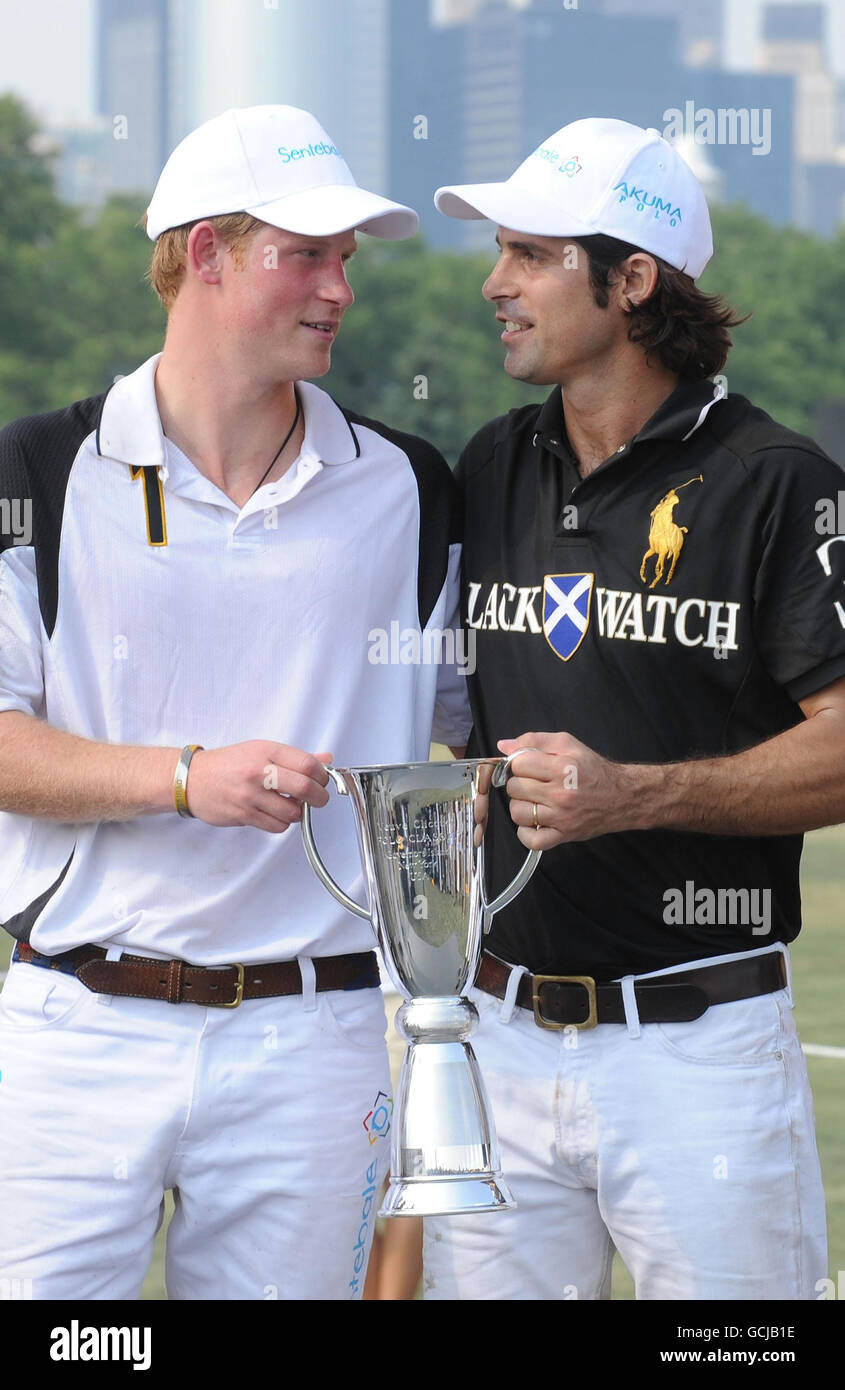 Prince Harry (left) and Polo player Nacho Figueras pose after the 3rd annual Veuve Clicquot Polo Classic on Governors Island in New York City. Stock Photo