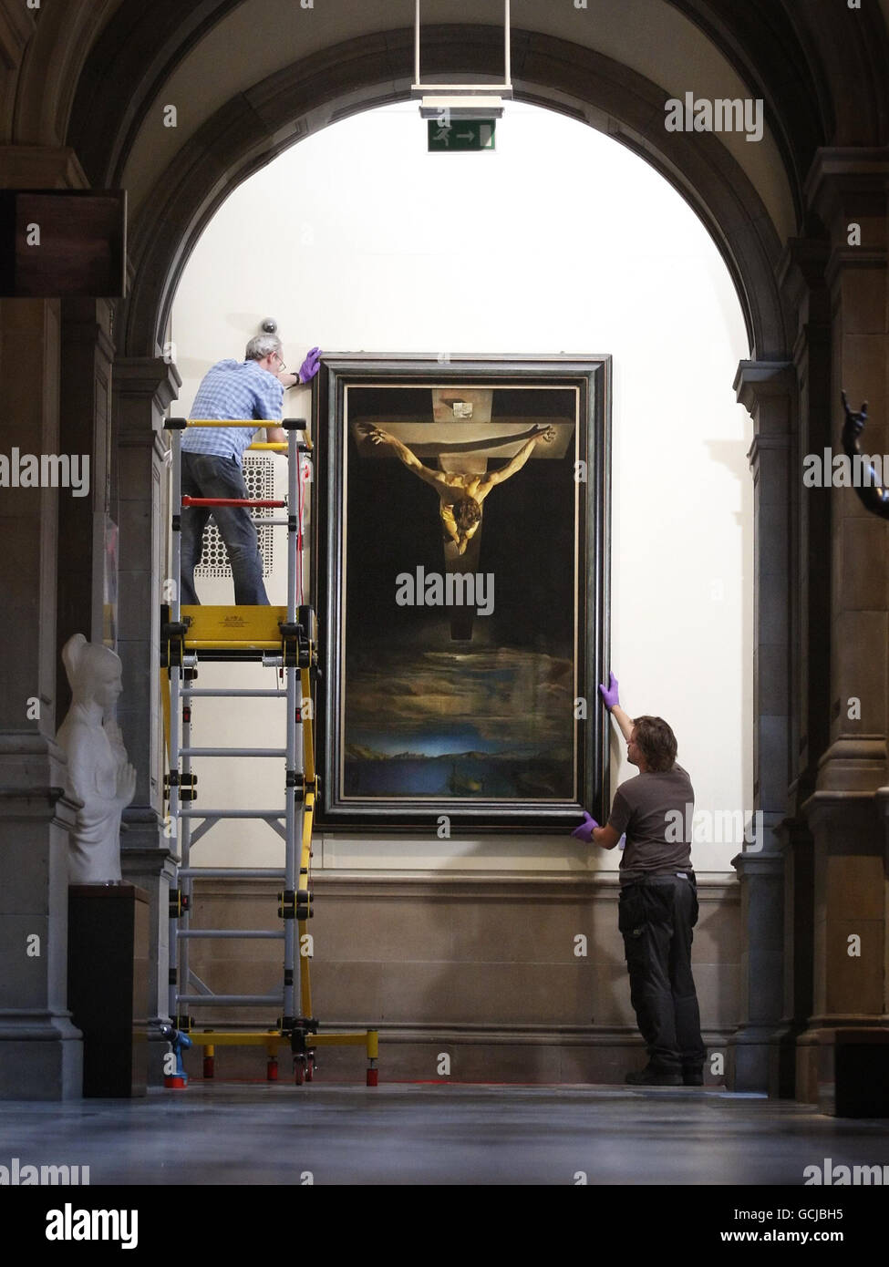 The Christ of St John of the Cross, a painting by Salvador Dali, is removed from display at the Kelvingrove Art Gallery and Museum in Glasgow, in preparation of its display at the Salvador Dali: The Late Work exhibition in Atlanta, USA. Stock Photo