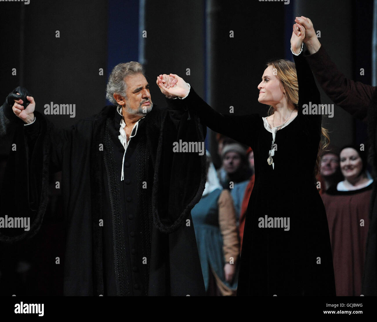 Placido Domingo takes a curtain call with Russian soprano Marina Poplavskaya, after performing in Verdi's Simon Boccanegra at the Royal Opera House in London - his 225th performance at the famous venue. The Spanish tenor sung in barritone, as demanded by the role. Stock Photo