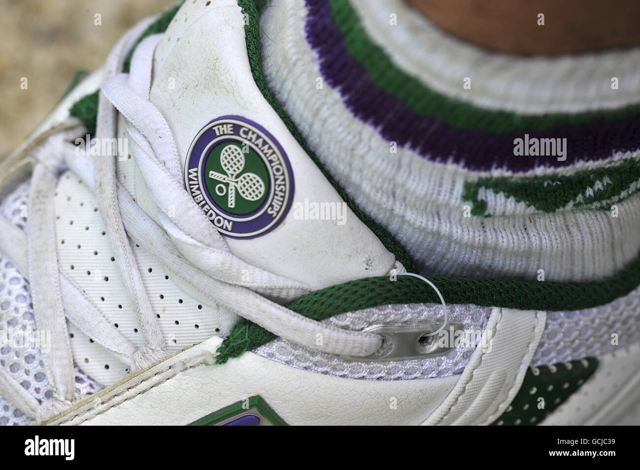 Tennis - 2010 Wimbledon Championships - Day Eight - The All England Lawn Tennis and Croquet Club. The Wimbledon logo on an shoe Stock Photo