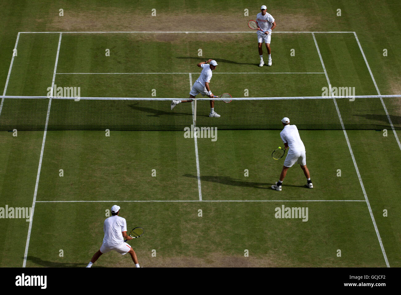 USA's Mike Bryan (top left) and Bob Bryan (top right) in action against Australia's Carsten Ball (bottom right) and Chris Guccione (bottom left) Stock Photo