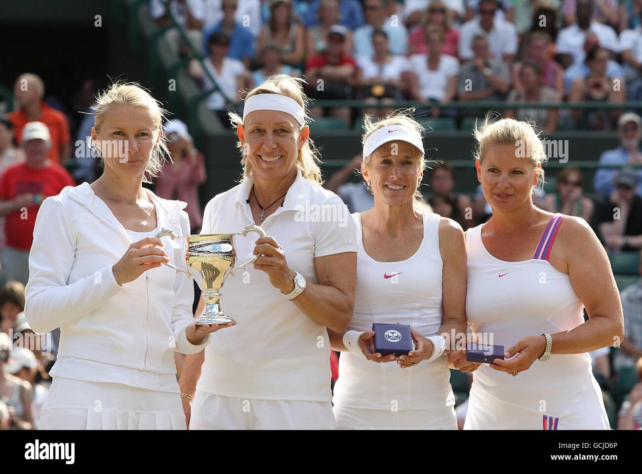 Czech Republic's Jana Novotna (left) and USA's Martina Navratilova (centre left) pose with their trophy after winning the Ladies' Invitation Doubles final, beating USA's Tracy Austin (centre right) and USA's Kathy Rinaldi-Stunkel (far right) by two sets to love. Stock Photo