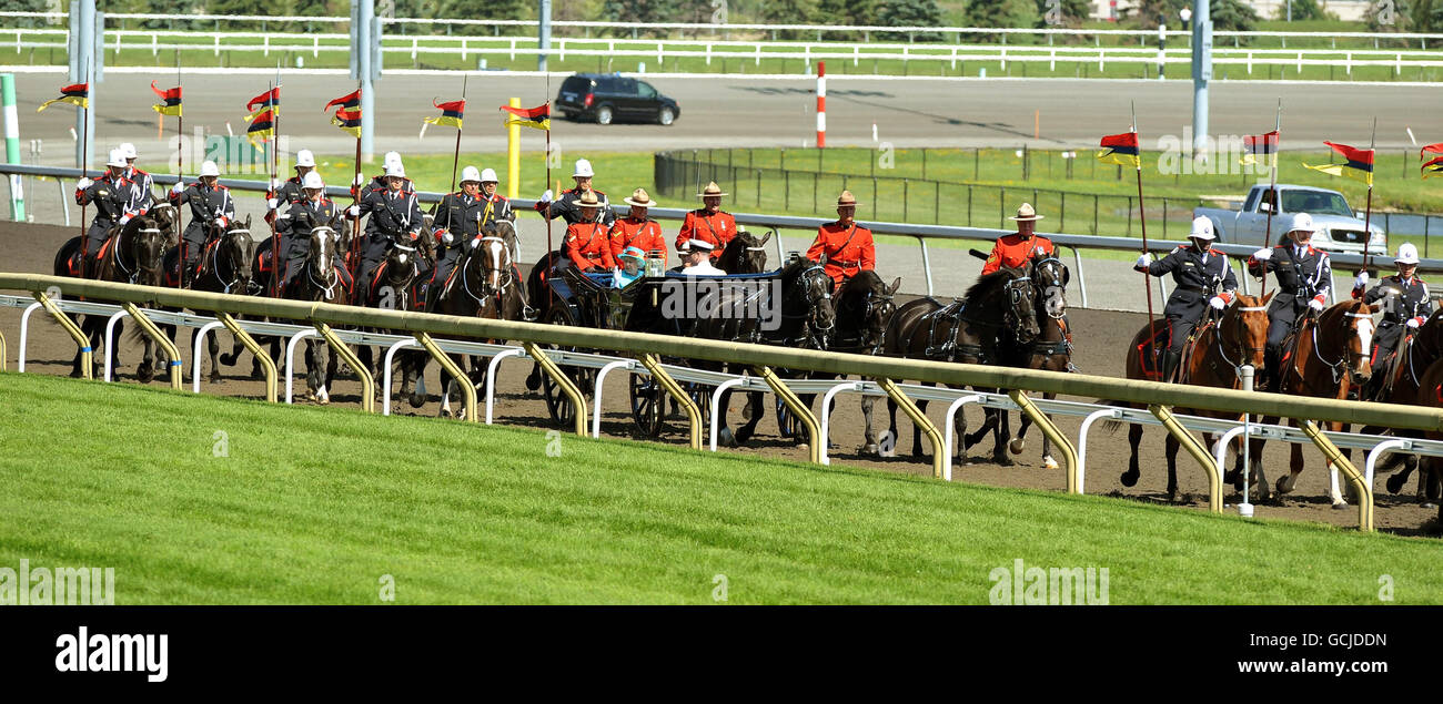 Britain's Queen Elizabeth II and the Duke of Edinburgh ride in an open