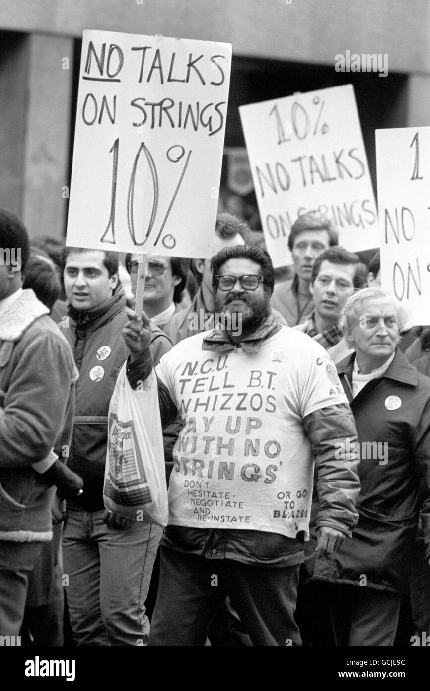 A marcher with his own personalised t-shirt message for British Telecom, taking part in the march from Smithfield Market, which rallied at Tower Hill. Stock Photo