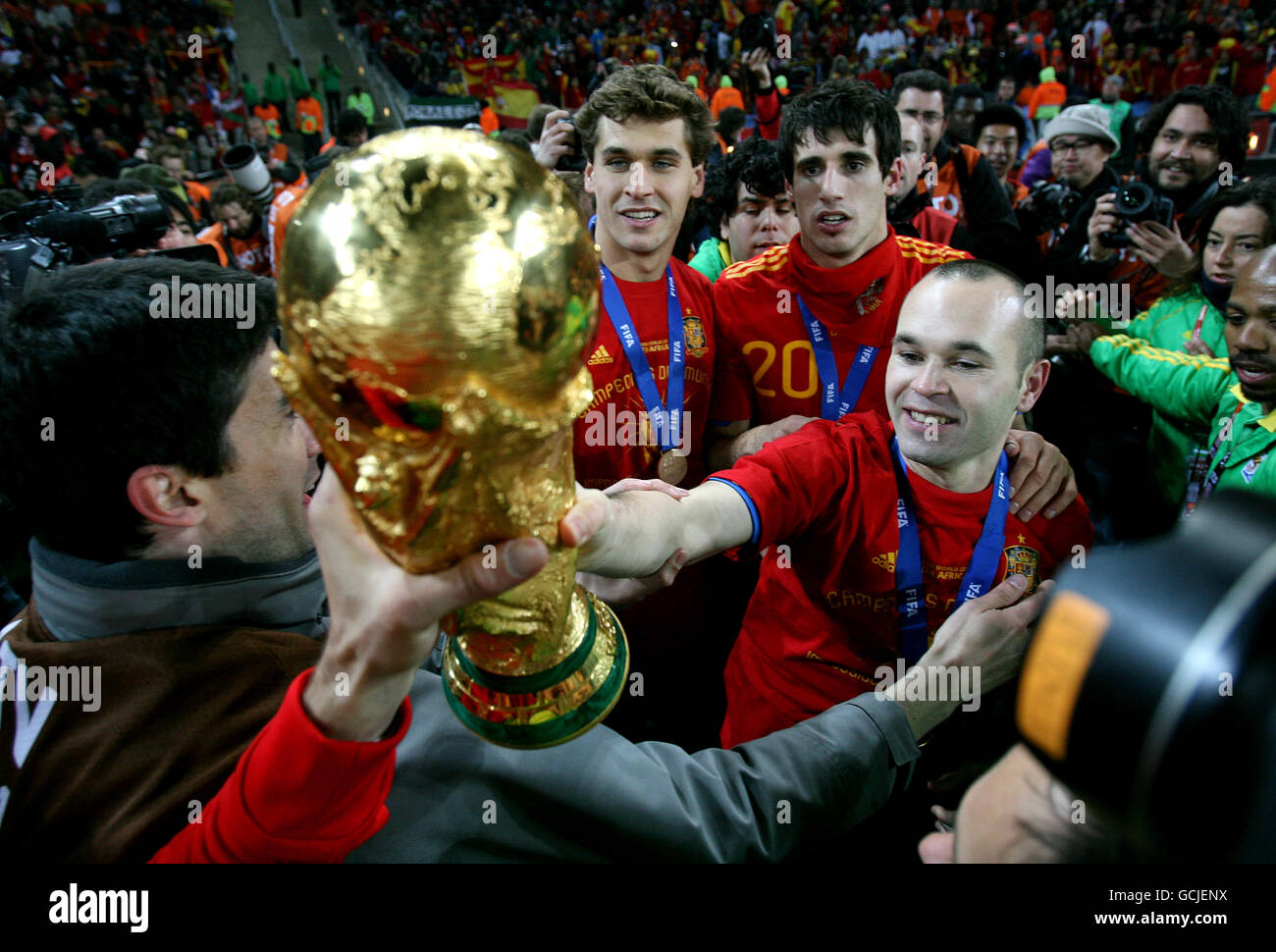 Soccer - 2010 FIFA World Cup South Africa - Final - Netherlands v Spain - Soccer City Stadium. Spain's Andres Iniesta celebrates with the World Cup trophy after winning against Netherlands Stock Photo