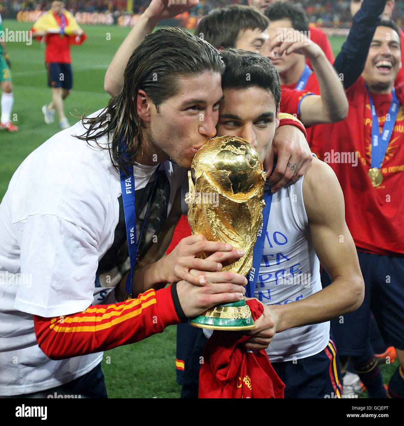 Soccer - 2010 FIFA World Cup South Africa - Final - Netherlands v Spain - Soccer City Stadium. Spain's Sergio Ramos and Jesus Navas celebrate with the World Cup trophy after winning against Netherlands Stock Photo