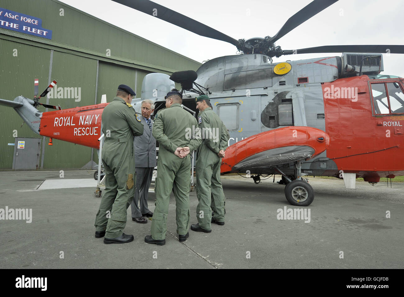 The Prince of Wales meets Search and Rescue crews, who fly a Sea King helicopter, the same aircraft as Prince William, during a visit to RNAS Culdrose, Cornwall. Stock Photo