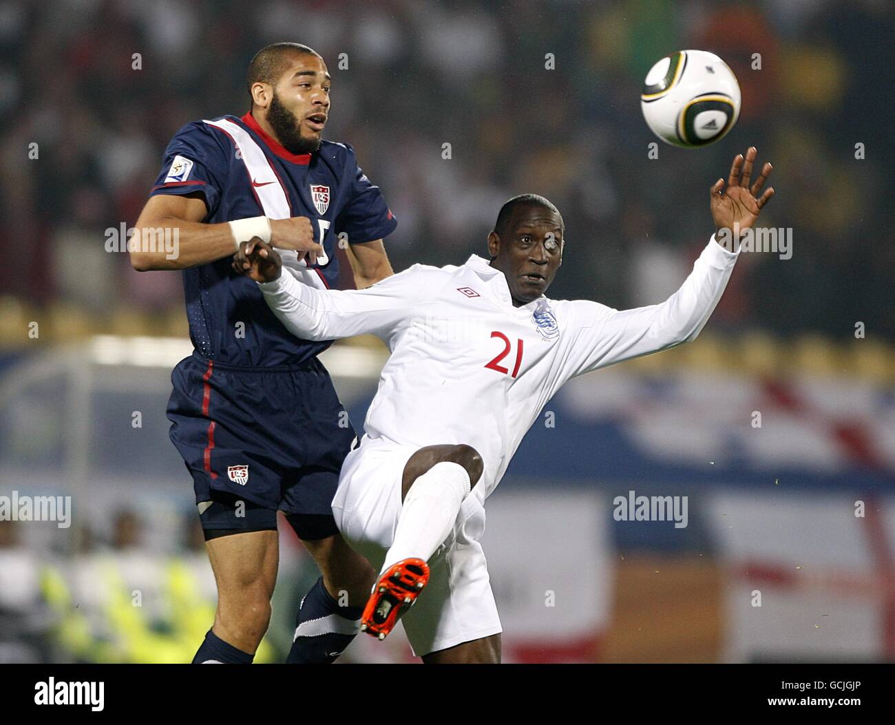 England's Emile Heskey (right) and USA's Oguchi Onyewu (left) battle for the ball Stock Photo