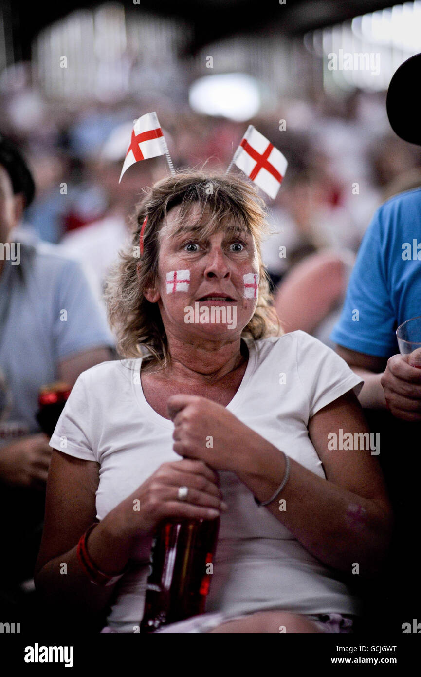 England fans gather inside a cattle shed on Washingpool Farm, Easter Compton, near Bristol to watch the World Cup match between England and the USA on a large screen that has been erected inside the cattle shed at Bristol Volksfest VW festival. Stock Photo