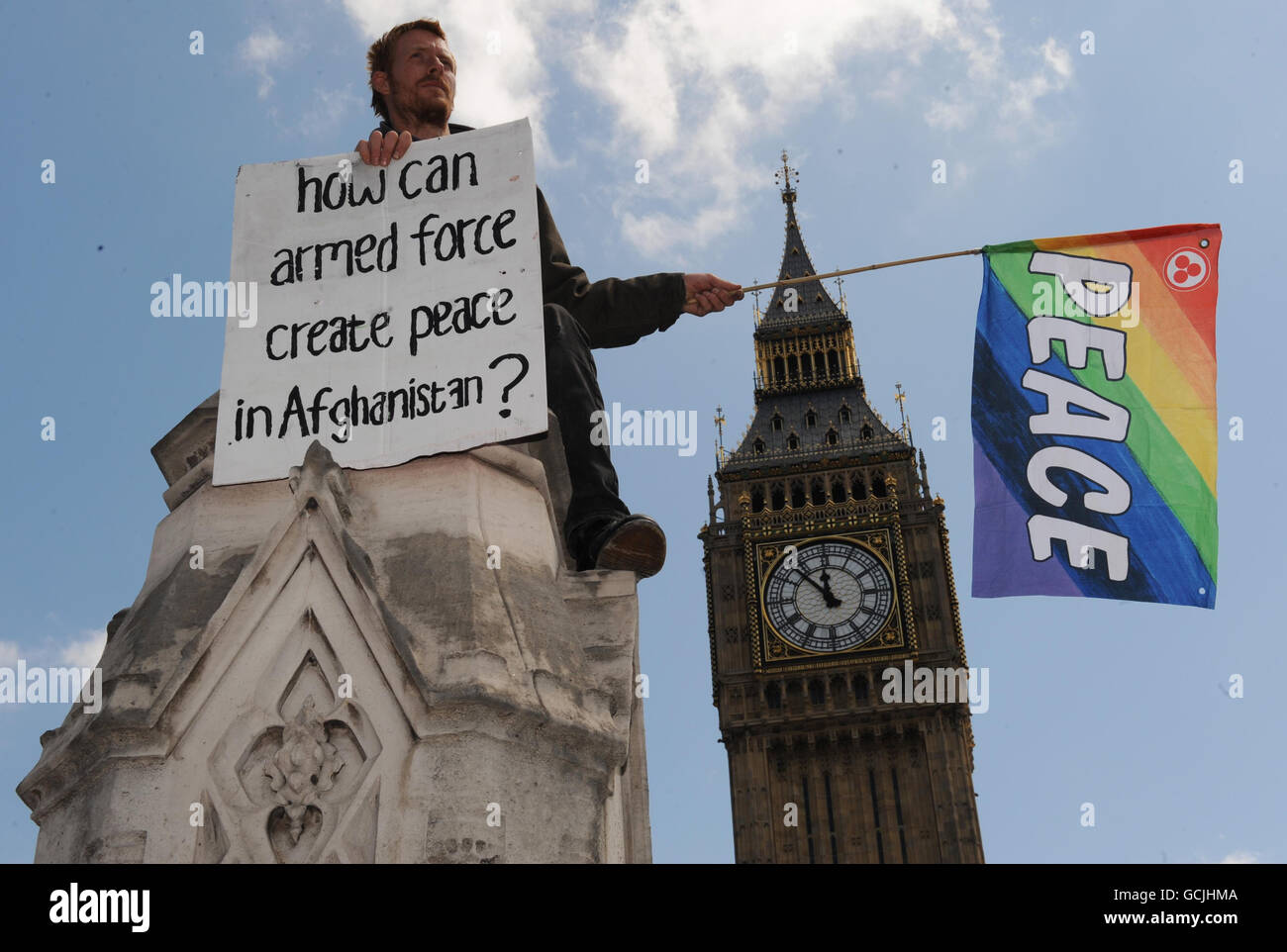 An anti-war protestor on the gates to the Palace of Westminster in London. Stock Photo