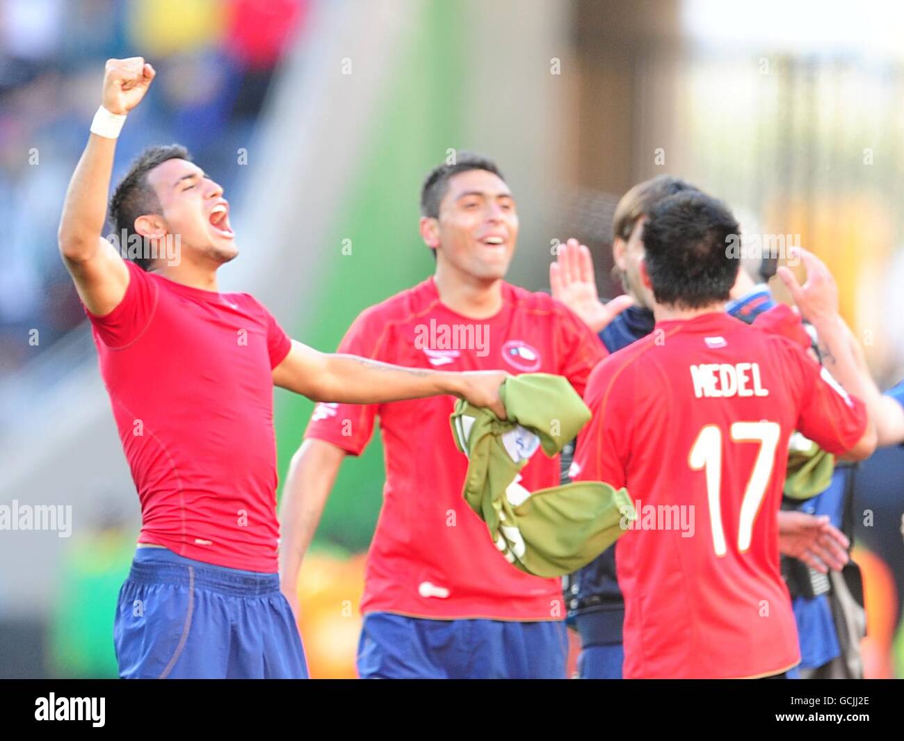 (L-R) Chile's Arturo Vidal, Gonzalo Jara and Gary Medel celebrate after the final whistle Stock Photo