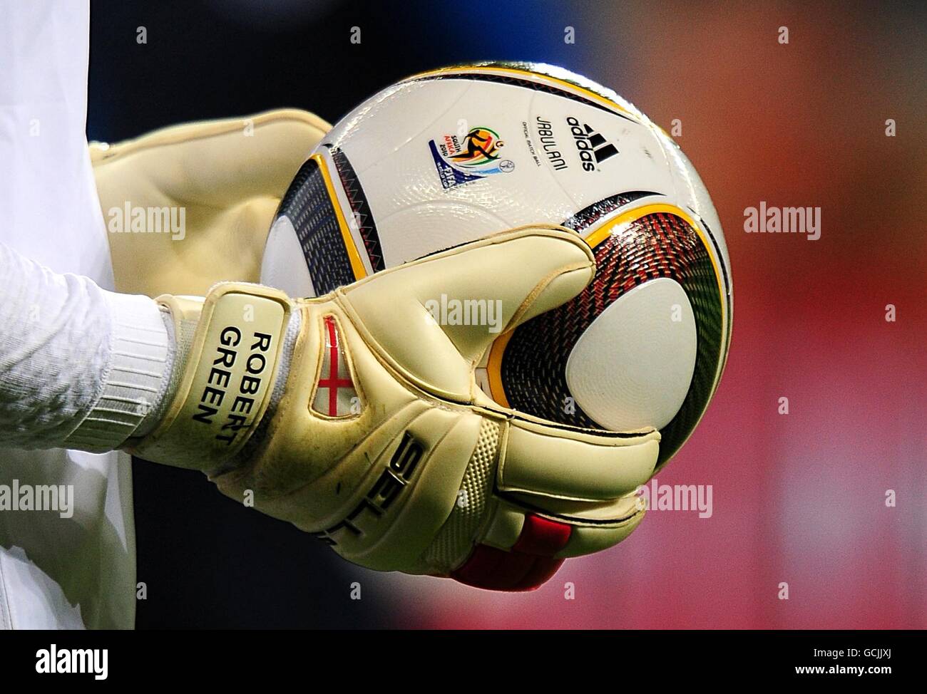 The Adidas Jabulani World Cup match ball in the hands of England goalkeeper Robert Green prior to kick off Stock Photo