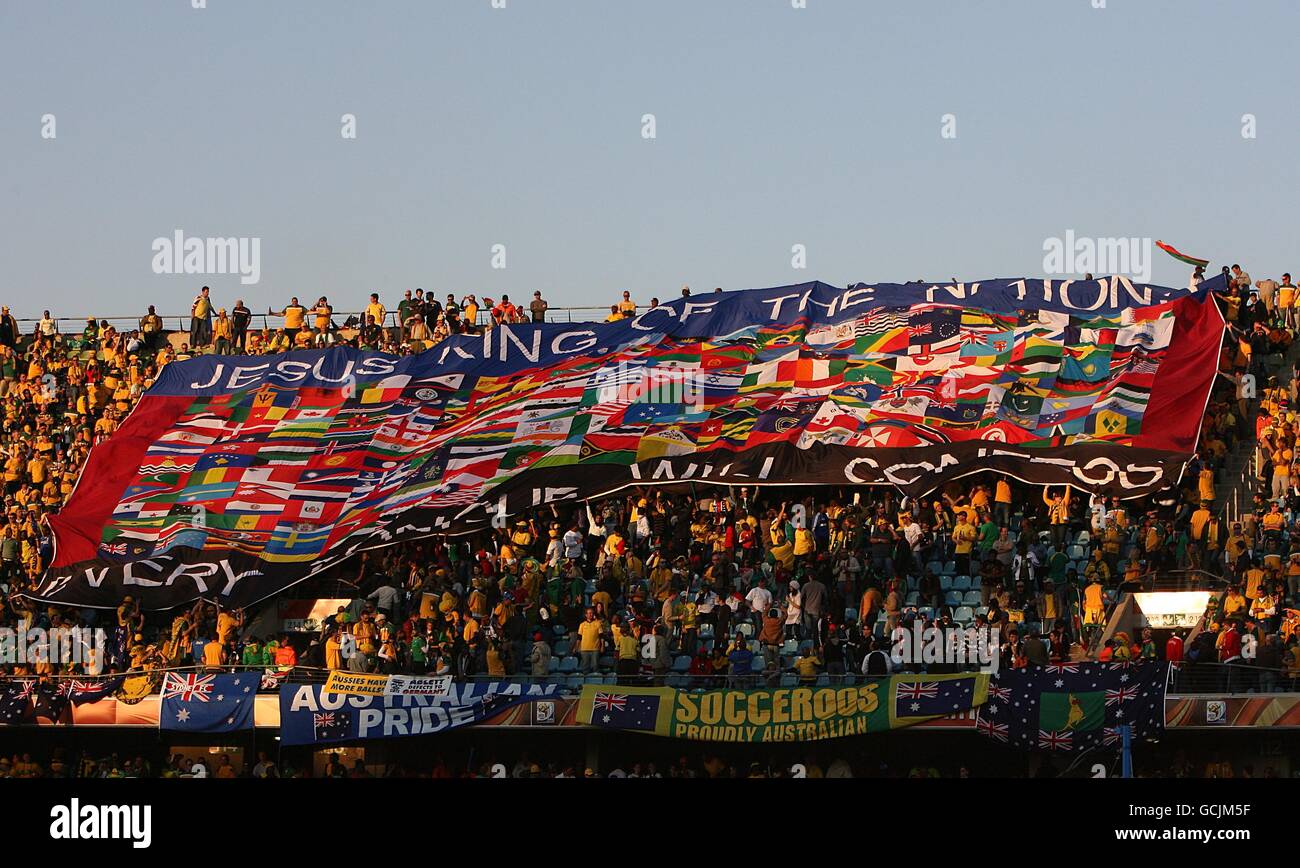 Fans in the stands display a huge banner saying Jesus King of Nations Every Tongue will confess in the stands Stock Photo