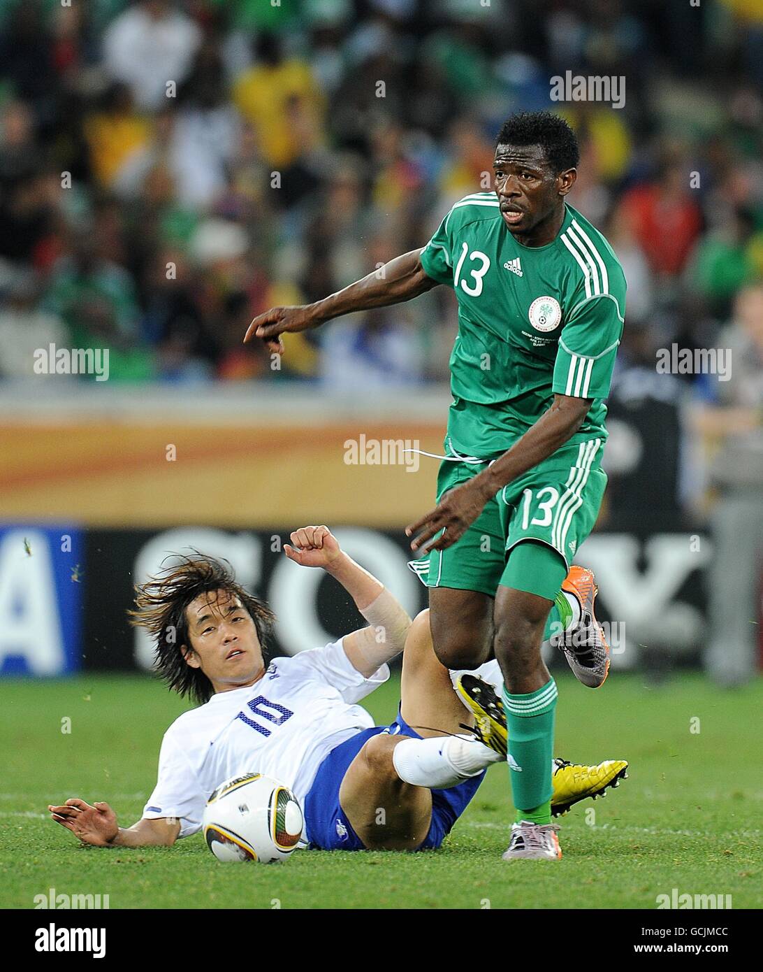 Nigeria's Ayiila Yussuf (right) and South Korea's Chu-Young Park (left) battle for the ball Stock Photo
