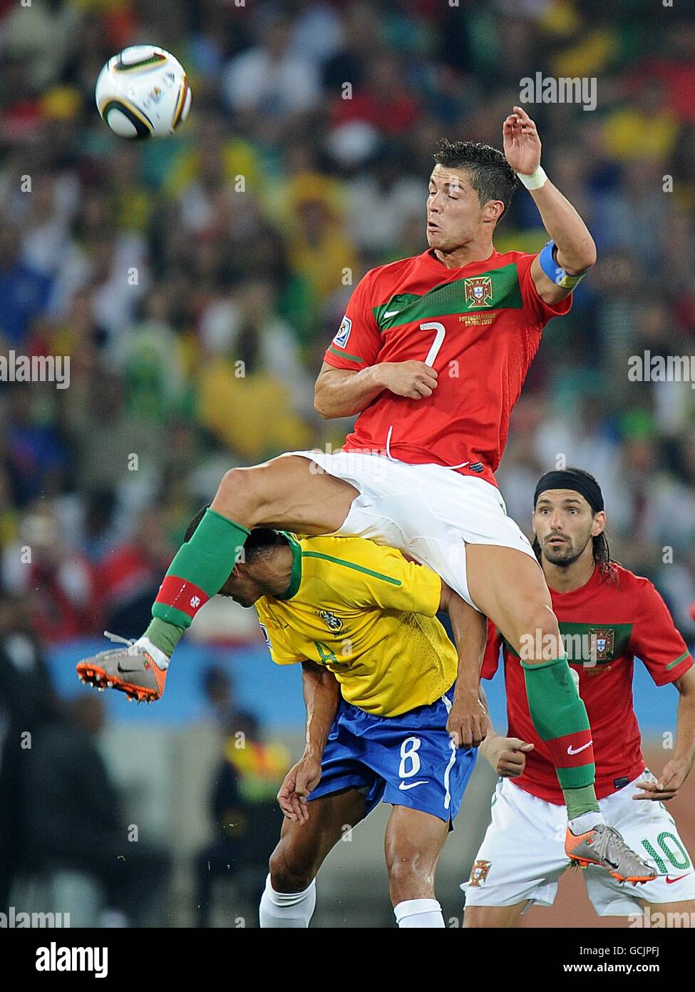 Soccer - 2010 FIFA World Cup South Africa - Group G - Portugal v Brazil - Durban Stadium. Brazil's Gilberto Silva (bottom) and Portugal's Cristiano Ronaldo (top) battle for the ball in the air Stock Photo