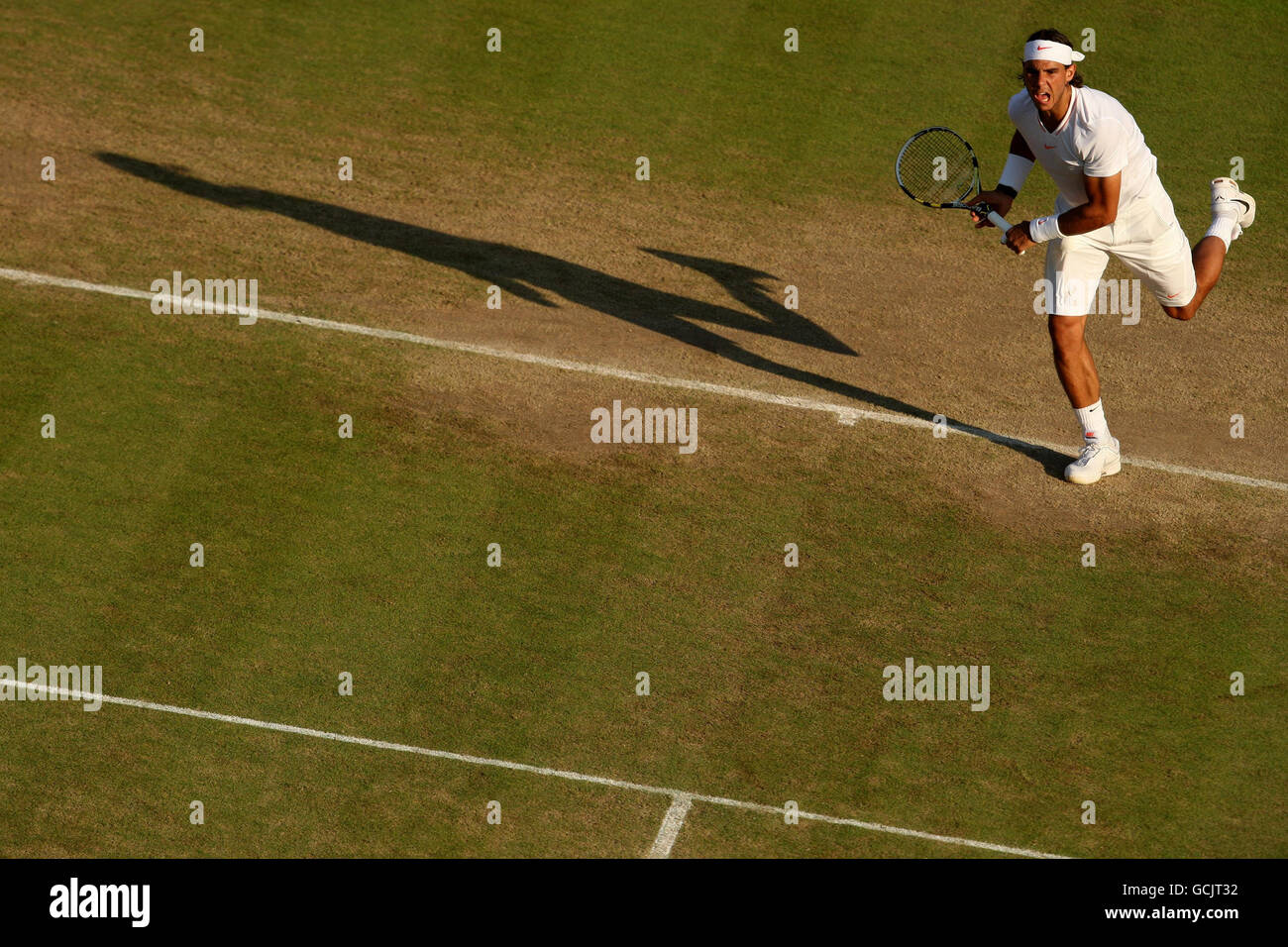 Spain's Rafael Nadal in action against France's Paul-Henri Mathieu during Day Seven of the 2010 Wimbledon Championships at the All England Lawn Tennis Club, Wimbledon. Stock Photo