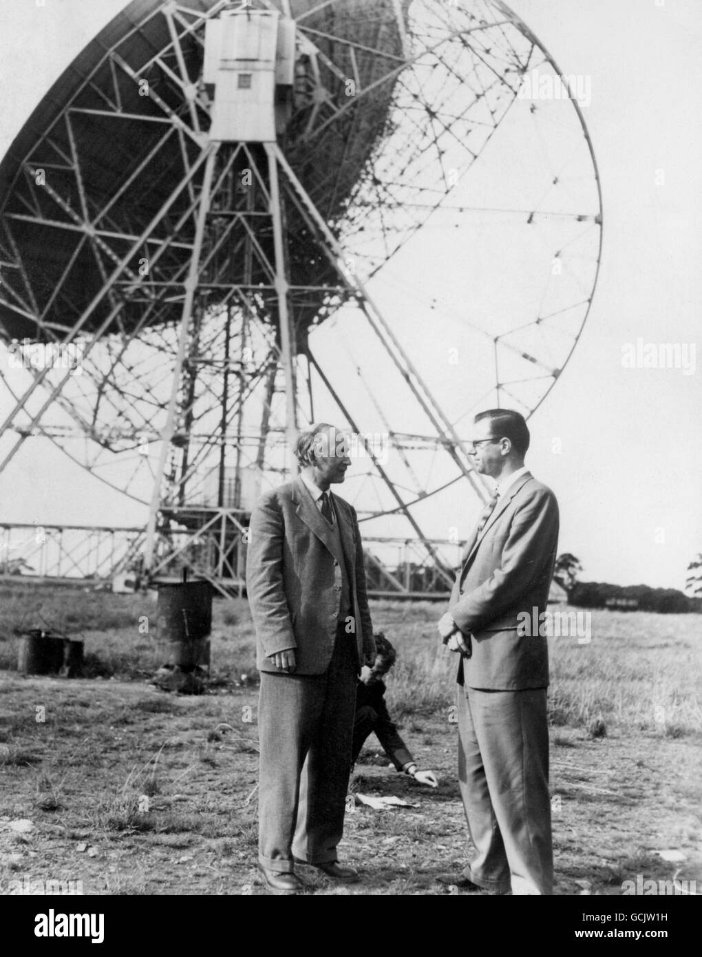 Professor sSir Bernard Lovell (left), director of the roadio astronomy station at Jodrell Bank, Cheshire, and John Taber, chief American scientist there, take a breather in the open air beside the 250ft wide bowl of Jodrell Bank's radio telescope today Staurday) as the giant instrument tracks the path of the American moon rocket fired from Cape Canaveral, Florida. Stock Photo