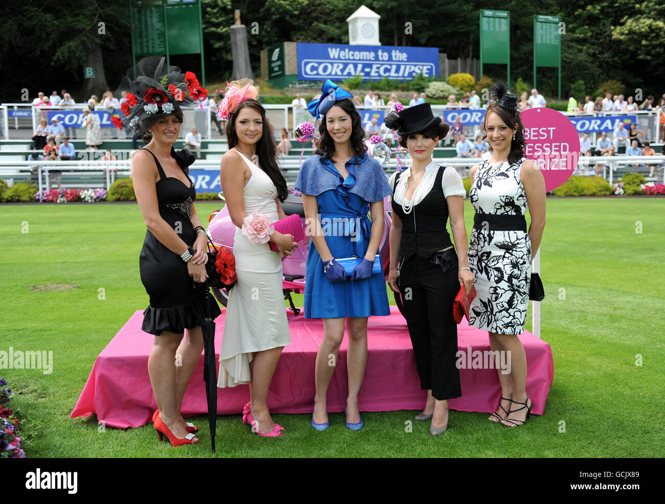 Horse Racing - Coral-Eclipse Day - Sandown Park. Racegoers take part in the Best Dressed Lady competition during the Coral-Eclipse Day at Sandown Park Stock Photo